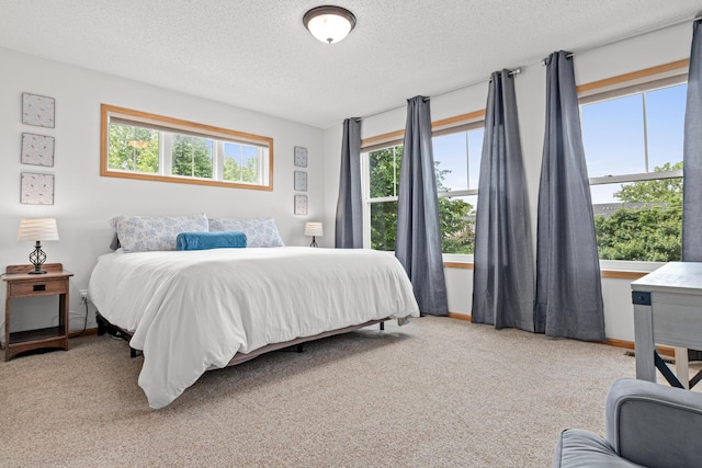 3010 Hazelwood St, Maplewood, MN 55109 - carpeted bedroom with a textured ceiling and baseboards