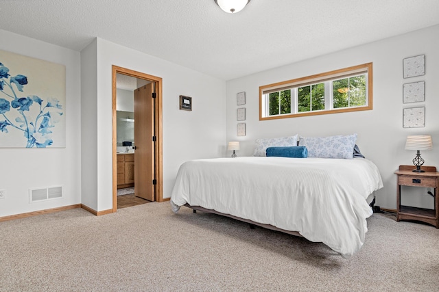 3010 Hazelwood St, Maplewood, MN 55109 - bedroom featuring carpet flooring, ensuite bathroom, and a textured ceiling