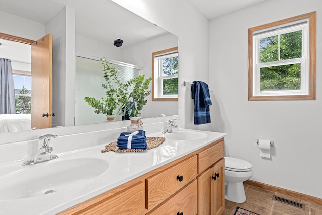 3010 Hazelwood St, Maplewood, MN 55109 - ensuite bathroom with double vanity and a shower stall