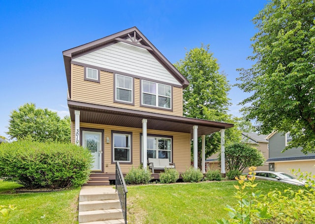 3010 Hazelwood St, Maplewood, MN 55109 - view of front facade with a porch and a front yard