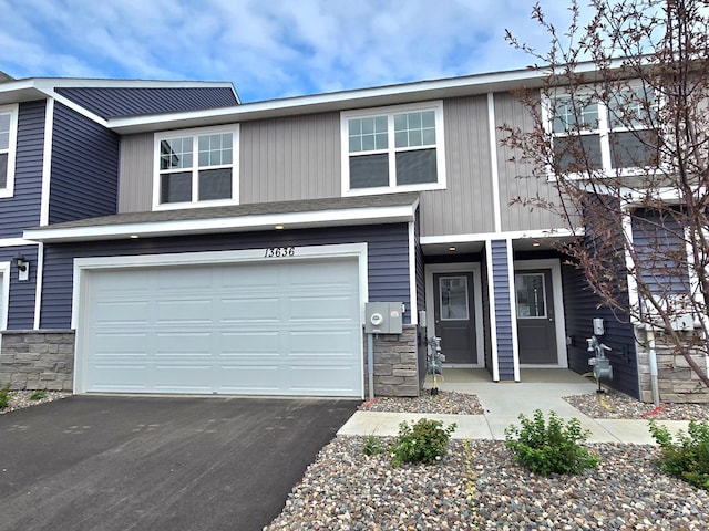 13636 Kaylemore Trl, Rosemount, MN 55068 - view of front of home featuring a garage, stone siding, and driveway