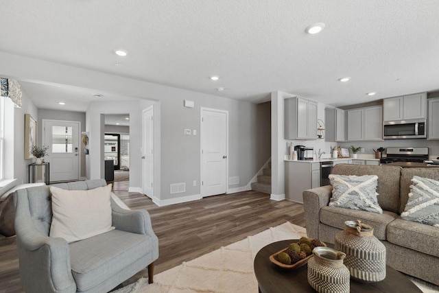 13636 Kaylemore Trl, Rosemount, MN 55068 - living area featuring stairs, wood finished floors, and recessed lighting
