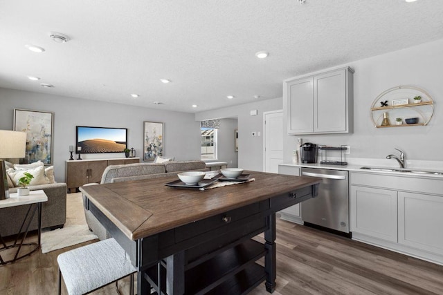 13636 Kaylemore Trl, Rosemount, MN 55068 - kitchen featuring dishwasher, wood finished floors, recessed lighting, a textured ceiling, and light countertops