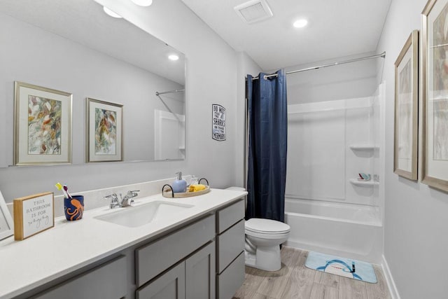 13636 Kaylemore Trl, Rosemount, MN 55068 - bathroom featuring vanity, wood finished floors, shower / tub combo with curtain, and recessed lighting