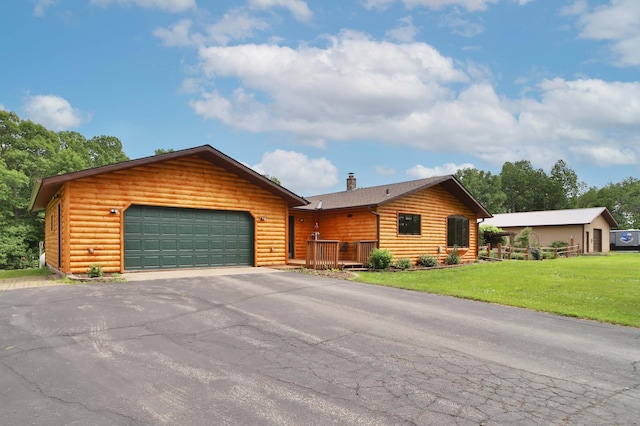 39808 340th Ln, Aitkin, MN 56431 - rustic home with faux log siding, driveway, a front lawn, and an attached garage