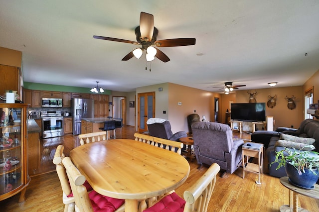 39808 340th Ln, Aitkin, MN 56431 - dining space featuring ceiling fan and light wood-style flooring