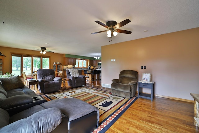 39808 340th Ln, Aitkin, MN 56431 - living area featuring a ceiling fan and light wood-style floors