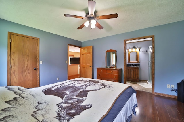 39808 340th Ln, Aitkin, MN 56431 - bedroom featuring dark wood-style flooring, ceiling fan, and connected bathroom