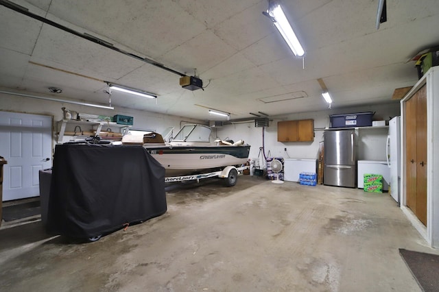 39808 340th Ln, Aitkin, MN 56431 - garage featuring freestanding refrigerator and a garage door opener