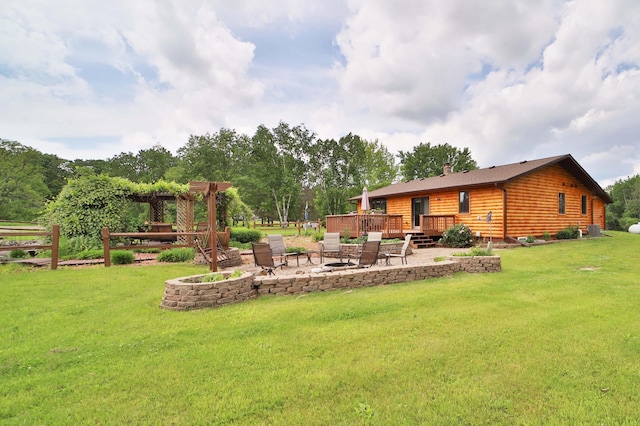 39808 340th Ln, Aitkin, MN 56431 - view of green lawn with a deck, a fire pit, and a patio