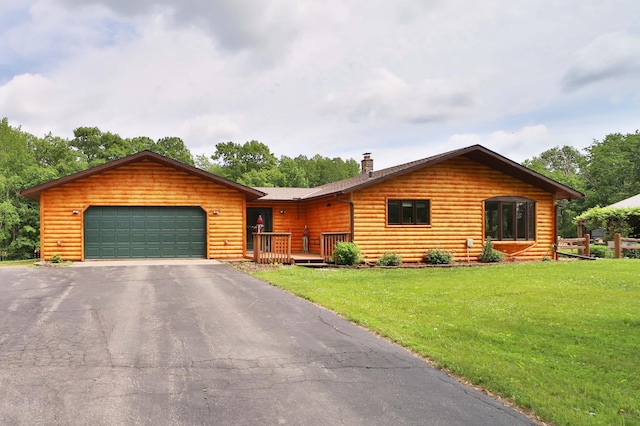39808 340th Ln, Aitkin, MN 56431 - view of front facade featuring a chimney, an attached garage, a front yard, and asphalt driveway