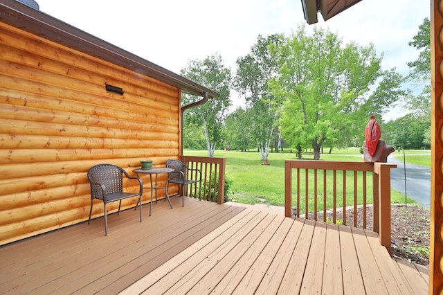 39808 340th Ln, Aitkin, MN 56431 - wooden terrace with a lawn and view of wooded area