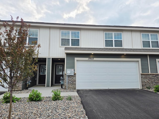 13643 Kaylemore Trl, Rosemount, MN 55068 - view of property featuring stone siding, driveway, and an attached garage