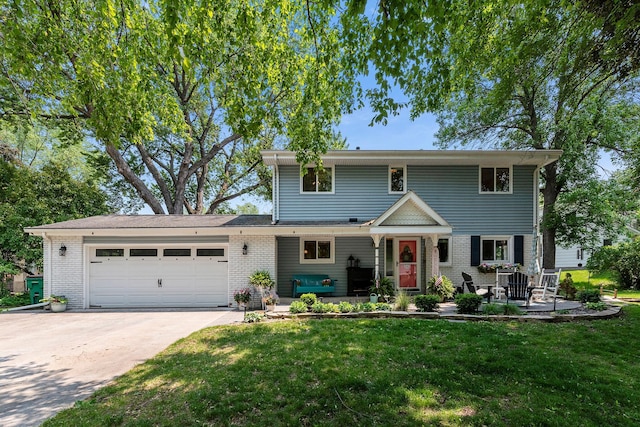 2068 Thorndale Ave, New Brighton, MN 55112 - traditional-style house featuring a garage, driveway, brick siding, and a front yard