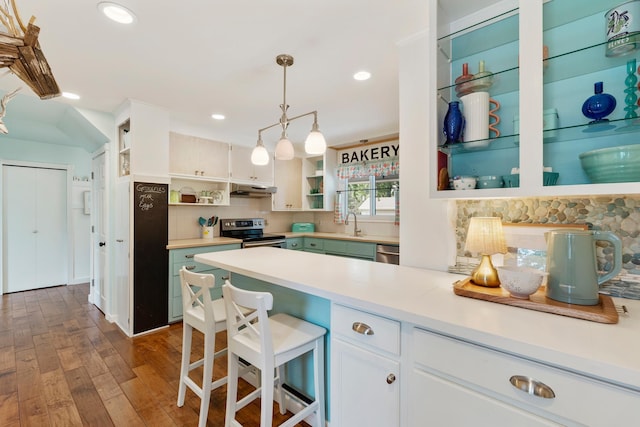 2068 Thorndale Ave, New Brighton, MN 55112 - kitchen with open shelves, appliances with stainless steel finishes, decorative backsplash, dark wood-style floors, and recessed lighting