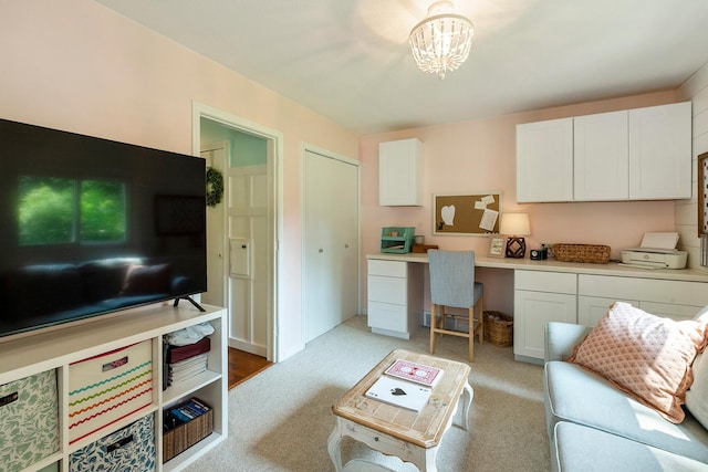 2068 Thorndale Ave, New Brighton, MN 55112 - living room featuring built in study area, a chandelier, and light carpet