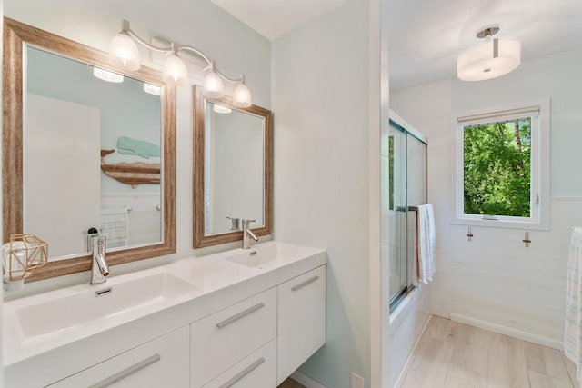 2068 Thorndale Ave, New Brighton, MN 55112 - full bathroom featuring double vanity and enclosed tub / shower combo