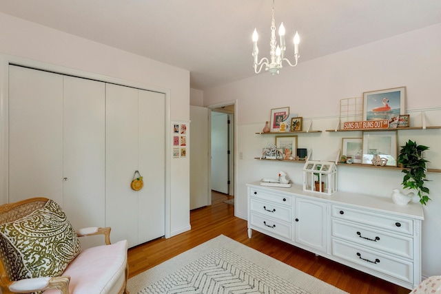 2068 Thorndale Ave, New Brighton, MN 55112 - sitting room featuring dark wood finished floors and a chandelier