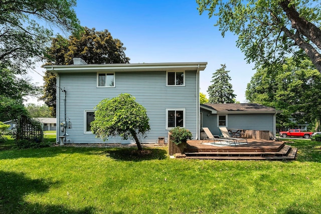 2068 Thorndale Ave, New Brighton, MN 55112 - rear view of property featuring a deck, a yard, and a chimney