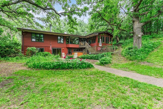 1350 Crestridge Ln, Eagan, MN 55123 - view of front of home featuring a sunroom, a wooden deck, and stairway
