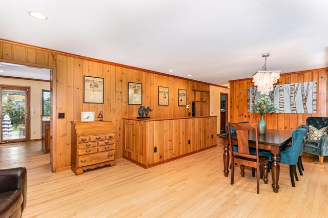 1350 Crestridge Ln, Eagan, MN 55123 - dining room with ornamental molding, a chandelier, wooden walls, light wood-style flooring, and recessed lighting