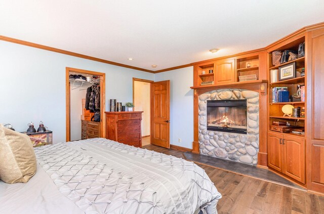 1350 Crestridge Ln, Eagan, MN 55123 - bedroom with a fireplace, dark wood finished floors, crown molding, and a closet