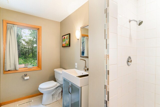 1350 Crestridge Ln, Eagan, MN 55123 - bathroom with a tile shower, vanity, and tile patterned flooring