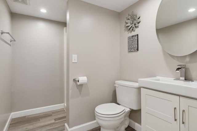 1475 Eldridge Ave E, Maplewood, MN 55109 - half bath featuring wood finished floors, vanity, and recessed lighting