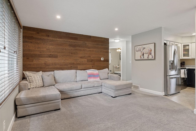 1475 Eldridge Ave E, Maplewood, MN 55109 - living area with wooden walls, light colored carpet, and recessed lighting