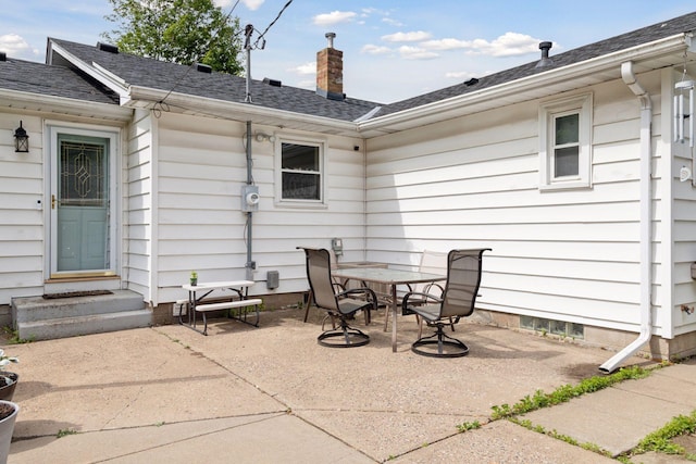 1475 Eldridge Ave E, Maplewood, MN 55109 - view of patio with outdoor dining area and entry steps