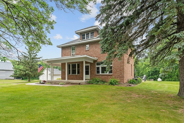 20930 St Francis Blvd NW, Nowthen, MN 55303 - back of property with brick siding, a lawn, and a porch