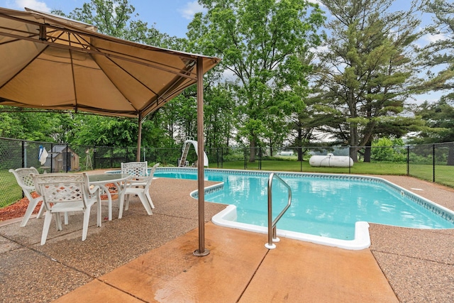 20930 St Francis Blvd NW, Nowthen, MN 55303 - view of pool with a fenced backyard, a water slide, and a patio area