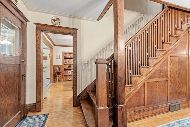 20930 St Francis Blvd NW, Nowthen, MN 55303 - staircase with ornamental molding and hardwood / wood-style flooring