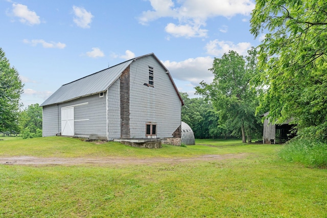 20930 St Francis Blvd NW, Nowthen, MN 55303 - view of barn featuring a lawn