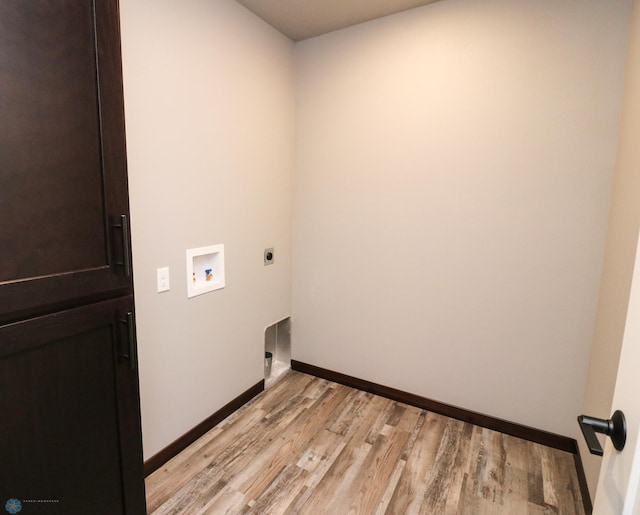 737 2nd Ave, Fargo, ND 58047 - washroom featuring electric dryer hookup, hookup for a washing machine, and light wood-style flooring