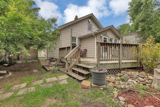 200 27th Ave N, Saint Cloud, MN 56303 - rear view of property with a chimney and a wooden deck