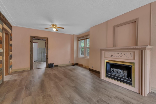 200 27th Ave N, Saint Cloud, MN 56303 - unfurnished living room featuring a fireplace, a ceiling fan, wood finished floors, and a textured ceiling