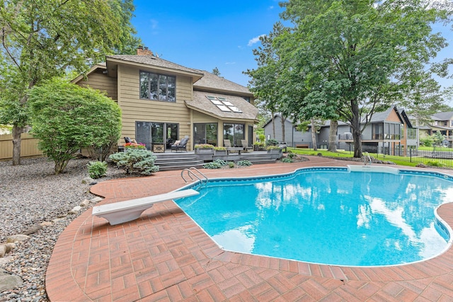 10810 Mississippi Blvd NW, Coon Rapids, MN 55433 - view of pool featuring a diving board, a fenced backyard, and a patio