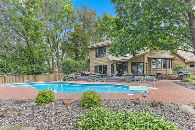 10810 Mississippi Blvd NW, Coon Rapids, MN 55433 - view of swimming pool featuring a deck, grilling area, and a patio
