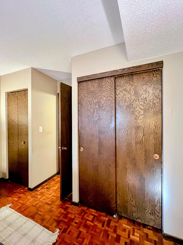 1200 Nicollet Mall Unit 205, Minneapolis, MN 55403 - unfurnished bedroom with a textured ceiling and two closets