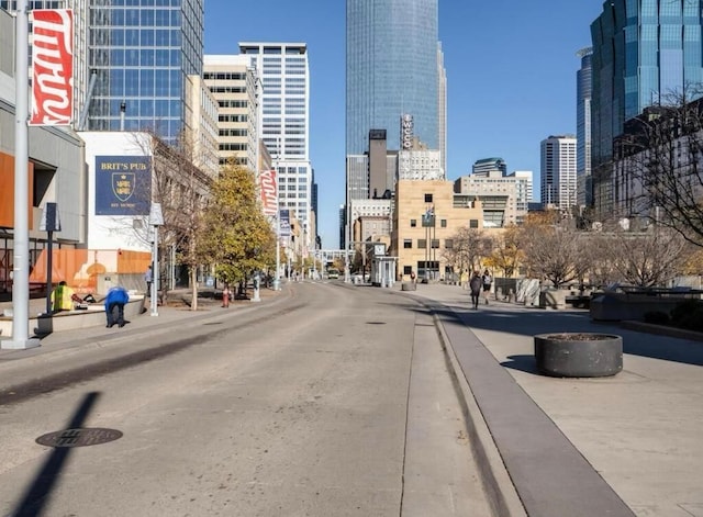 1200 Nicollet Mall Unit 205, Minneapolis, MN 55403 - view of asphalt street with a skyline view, sidewalks, and curbs