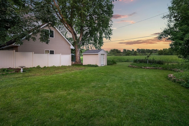 1218 4th Ave SE, Austin, MN 55912 - yard at dusk featuring a storage unit