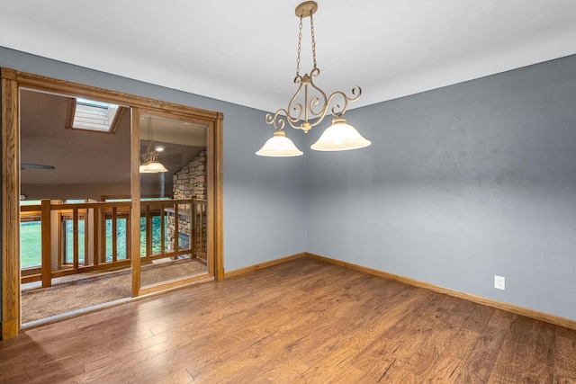 1218 4th Ave SE, Austin, MN 55912 - spare room with wood finished floors and healthy amount of natural light
