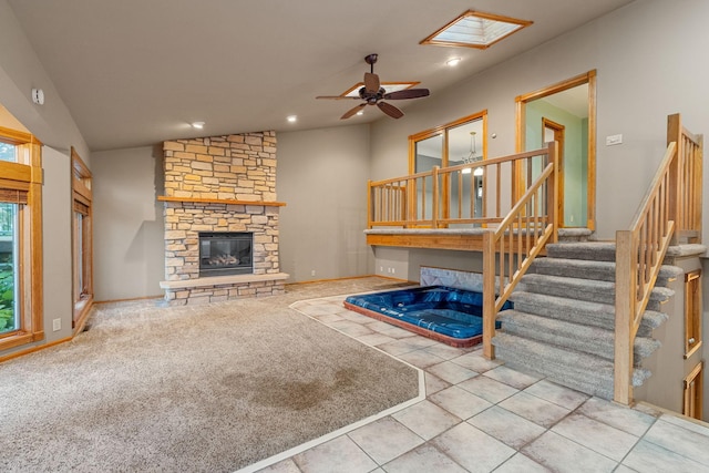 1218 4th Ave SE, Austin, MN 55912 - living area featuring ceiling fan, a stone fireplace, stairs, recessed lighting, and vaulted ceiling