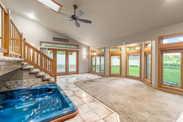1218 4th Ave SE, Austin, MN 55912 - foyer entrance featuring tile patterned floors, french doors, a ceiling fan, high vaulted ceiling, and stairs