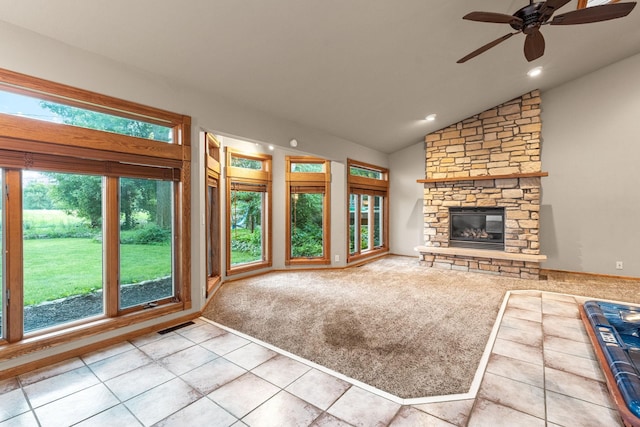 1218 4th Ave SE, Austin, MN 55912 - unfurnished living room with lofted ceiling, a ceiling fan, plenty of natural light, tile patterned flooring, and a fireplace