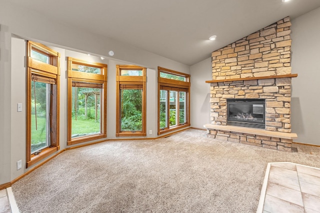 1218 4th Ave SE, Austin, MN 55912 - unfurnished living room with lofted ceiling, carpet floors, and a fireplace