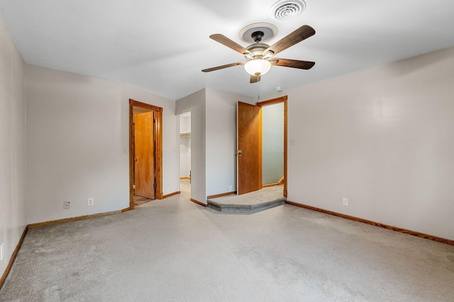 1218 4th Ave SE, Austin, MN 55912 - unfurnished bedroom with carpet flooring and ceiling fan