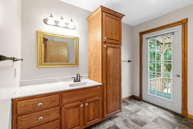 1218 4th Ave SE, Austin, MN 55912 - bathroom with vanity and baseboards