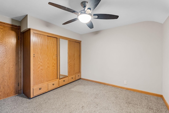 1218 4th Ave SE, Austin, MN 55912 - unfurnished bedroom featuring light carpet and ceiling fan